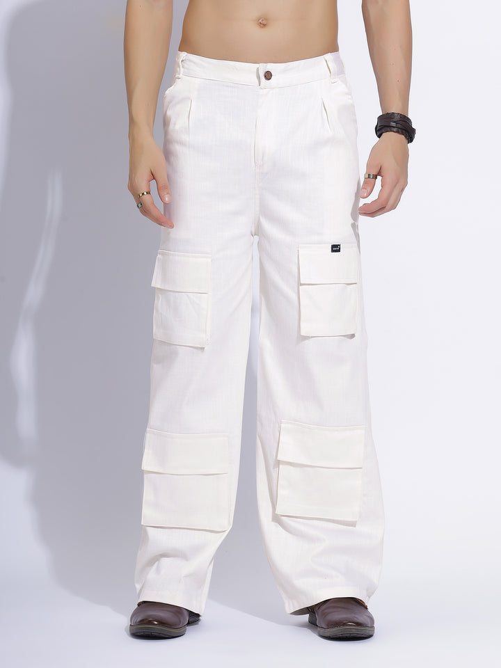 Front view of white cargo pants, featuring multiple pockets and a relaxed fit