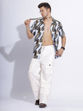 Model wearing white cargo pants with a casual outfit, demonstrating the pants' versatile style